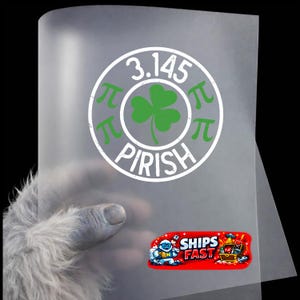 May include: A transparent sheet with a white circular design featuring the numbers "3.145", the word "PIRISH", a green shamrock, and the pi symbol. A red sticker with the words "SHIPS FAST" is also visible.