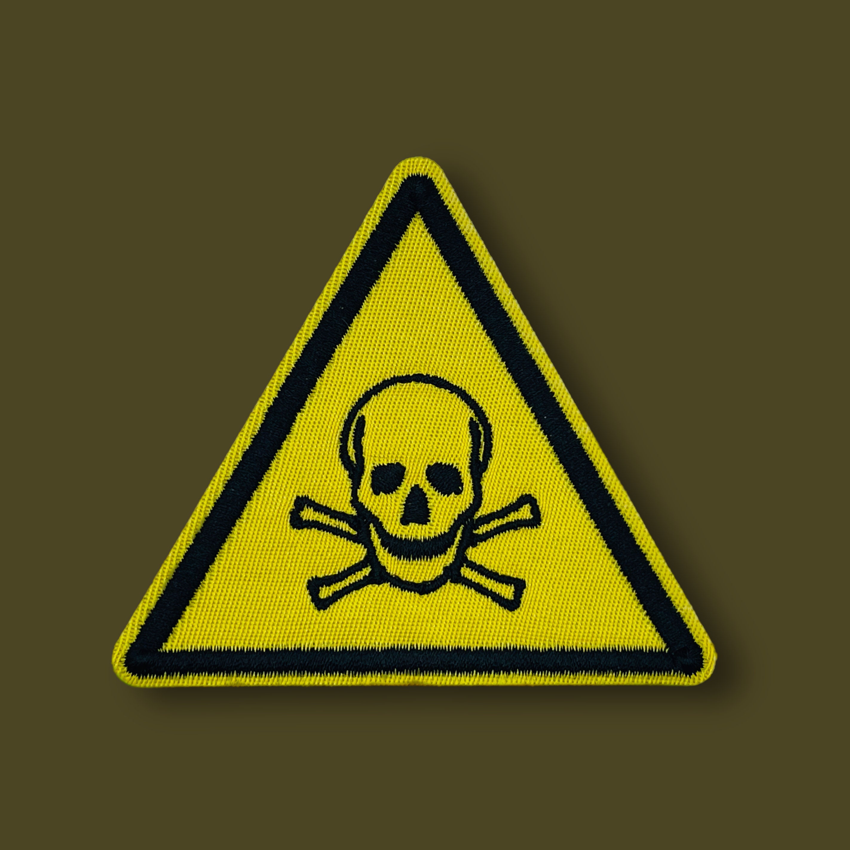 Toxic symbol with skull and crossbones on a yellow square