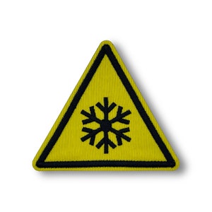 May include: Yellow triangle warning sign with a black snowflake inside. The sign has a black border.