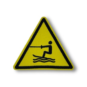 Varningsskylt för vattenskidåkning
