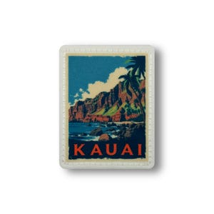 May include: Rectangular patch featuring a scenic illustration of Kauai, Hawaii. The design includes a blue sky, ocean, mountains, and palm trees. The word "KAUAI" is printed in orange at the bottom. The patch has a white border.