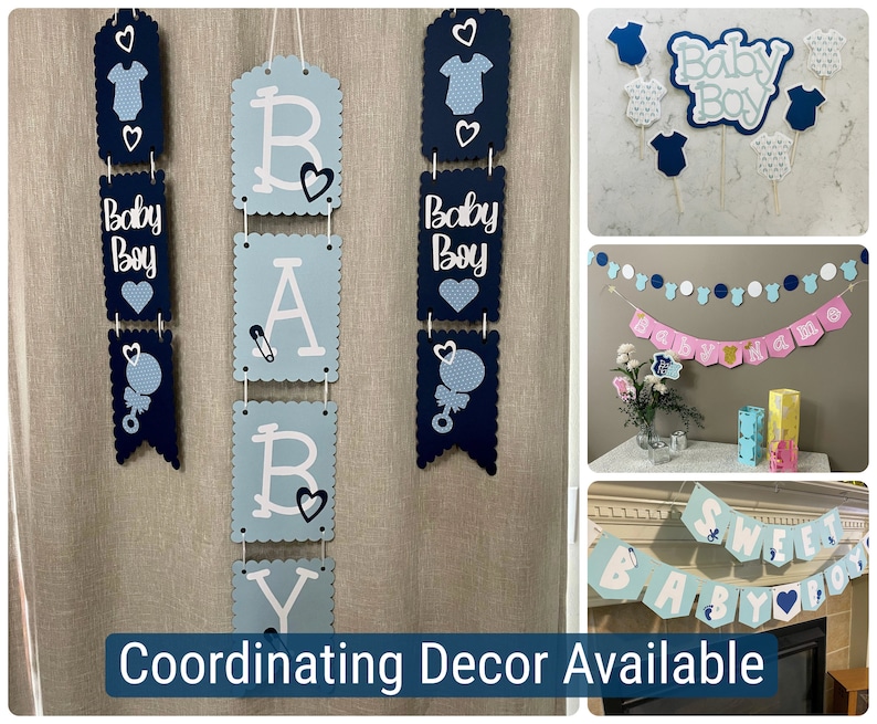 Op de afbeelding: Blauwe en witte babyborstdecoraties met de woorden "Baby Boy" en "Baby" op banners en vlaggetjes. De decoraties hangen aan een muur en bevatten een banner met de tekst "Baby Boy" en een banner met de tekst "Baby".
