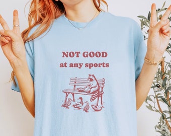 Not Good at any Sports - Unisex Cotton Shirt - Funny Racoon Meme T-Shirt