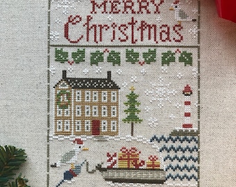 Christmas by the Sea house with lighthouse, gifts in a boat primitive folk art cross stitch pattern PDF by Acadia Stitchery