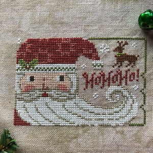Santa Ornament 2022, cute vintage face, swirly beard and Rudolph deer primitive folk art cross stitch pattern PDF by Acadia Stitchery