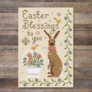 Paaszegen, een schattig konijntje, mand met lentebloemen en kuikens primitieve volkskunst kruissteekpatroon pdf door Acadia Stitchery