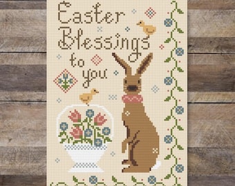 Bênçãos de Páscoa, um coelhinho fofo, cesta de flores da primavera e pintinhos - padrão de ponto cruz em estilo folclórico primitivo em PDF da Acadia Stitchery.