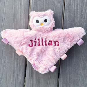 May include: Pink plush owl security blanket with a pink satin ribbon and the name "Jillian" embroidered in red.