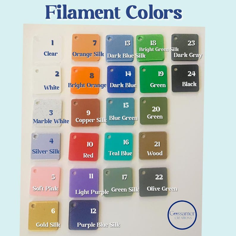 May include: A color chart displaying various filament colors, including clear, white, marble white, silver silk, soft pink, gold silk, orange silk, bright orange, copper silk, red, light purple, and purple blue silk. The chart also includes dark blue silk, teal blue, green silk, and olive green.