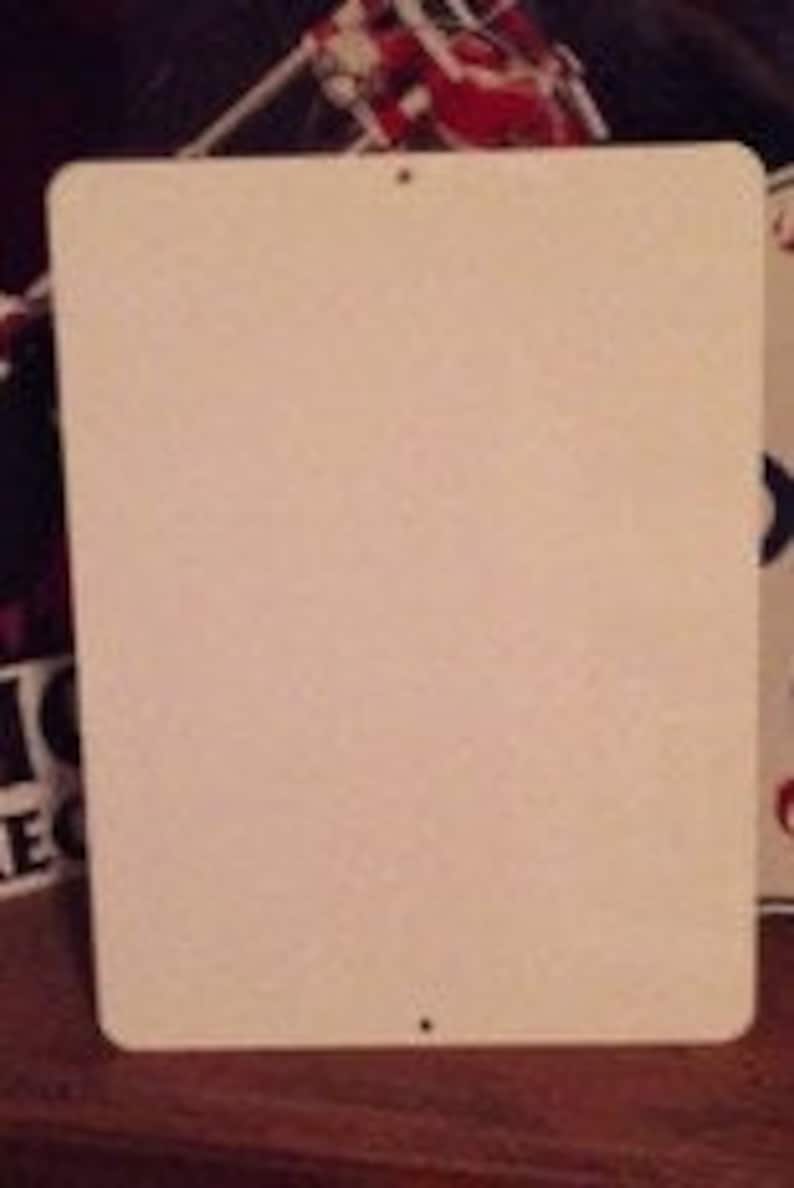 May include: Blank metal sign with two small holes in the top corners.