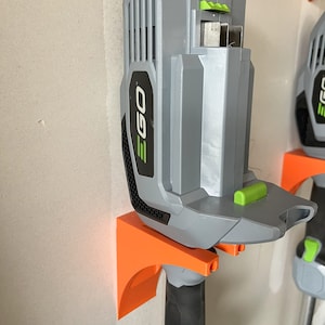 EGO power yard tool holder - robust. Holds tools and add-ons. Made in USA.