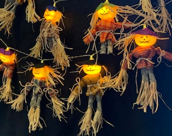 Scarecrow pattern using novelty pumpkin jack-o-lantern lights. Pattern for bodies and hats only. Pumpkin head lights are purchased.