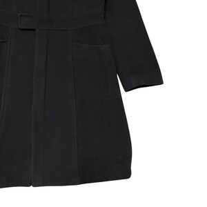 May include: Black coat with a belt and two front pockets. The coat has long sleeves and a tailored fit. The fabric appears to be a medium-weight material, suitable for cooler weather. The coat is a solid black color.