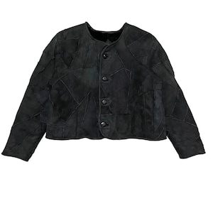 May include: A black suede jacket with a patchwork design and button closure.