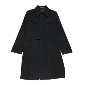 May include: A black coat with a collared neckline, two chest pockets, and two lower pockets. The coat features a belt at the waist and long sleeves. The coat is made of a solid, dark material.