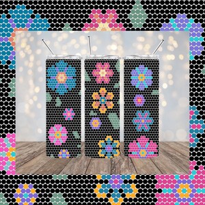 May include: Three stainless steel tumblers with a black background and colorful floral designs. The designs are made up of small circles in various colors, including pink, blue, yellow, and green.