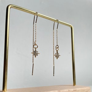 Gold dangling earring