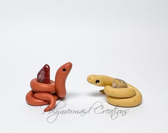 Tiny snek hugging rock - miniature polymer clay snake figure