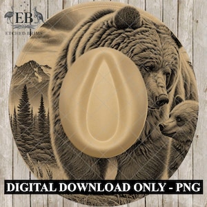 May include: A tan cowboy hat with a detailed illustration of a grizzly bear and cub. The hat features a wide brim with a mountain and forest scene. The text "DIGITAL DOWNLOAD ONLY - PNG" is at the bottom.