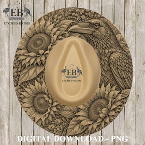 May include: A tan hat featuring an intricate etched design of a large raven and multiple sunflowers. The centre of the hat displays the logo EB ETCHED BRIMS with silhouettes of a bird and a kangaroo. The design covers the entire brim surface.