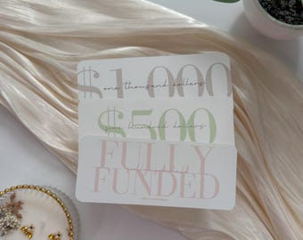 May include: Three gift cards with dollar signs and text. The top card reads "$1,000 one thousand dollars", the middle card reads "$500 five hundred dollars", and the bottom card reads "FULLY FUNDED".