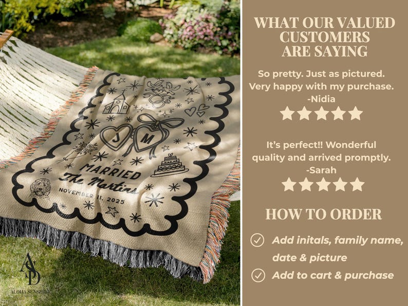 May include: A beige personalized wedding blanket with black decorative elements, including hearts, stars, and a cake. The blanket features the text "MARRIED" and the date "NOVEMBER 11, 2025". It has a scalloped edge and fringe.