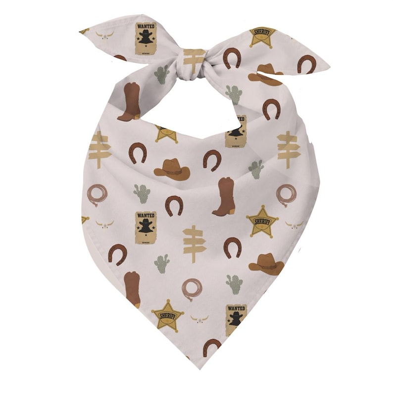 May include: A white triangular bandana featuring a repeating pattern of brown cowboy boots, brown cowboy hats, gold sheriff stars, brown horseshoes, green cacti, tan directional signs, lassos, and tan wanted posters with the text WANTED.