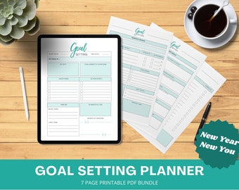 May include: A digital tablet displaying a printable goal setting planner with the text "Goal Setting" in a teal blue font. The planner is divided into sections for setting goals, milestones, action steps, and timelines. The tablet is on a wooden surface with a cup of coffee and a pen.