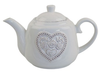 Encantadora tetera blanca con diseño de corazón floral en relieve, perfecta para los amantes del té y la decoración romántica del hogar