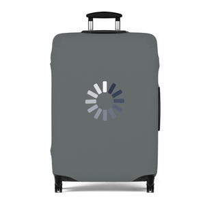 May include: A gray suitcase cover with a white and blue loading symbol in the center. The luggage cover has a handle at the top and wheels at the bottom, designed to protect a suitcase during travel.