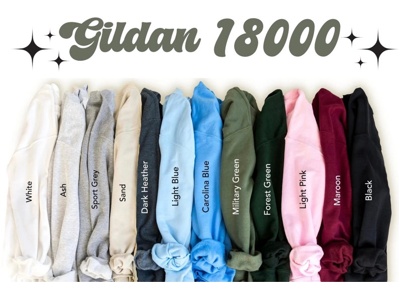 May include: A variety of Gildan 18000 sweatshirts in different colors, including white, ash, sport grey, sand, dark heather, light blue, carolina blue, military green, forest green, light pink, maroon, and black.