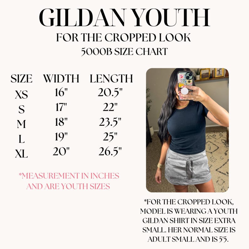 May include: A size chart for Gildan Youth cropped shirts, with measurements in inches. The chart includes sizes XS to XL, with width ranging from 16" to 20" and length from 20.5" to 26.5". The image also shows a person wearing a black shirt.