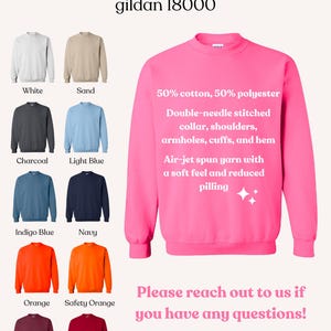 May include: A product image showcasing a selection of Gildan 18000 sweatshirts in various colors: white, sand, charcoal, light blue, indigo blue, navy, orange, safety orange, maroon, and cardinal red. The image also highlights the sweatshirt's features and the brand name.