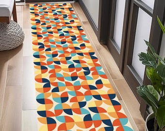 May include: A geometric patterned runner rug with a cream background and colorful circles in shades of orange, yellow, blue, and navy. The rug is laid out in a hallway with wooden floors.
