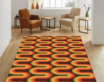 May include: A retro-style area rug with a repeating pattern of brown, orange, and green arches. The rug is laid out on a wooden floor in a living room setting.