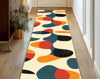May include: A cream-colored runner rug with a geometric pattern of orange, red, teal, and black circles. The rug has a subtle texture and is perfect for adding a modern touch to any hallway or entryway.