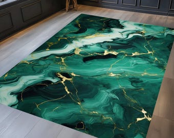May include: A rectangular area rug with a malachite-inspired design. The rug features swirling shades of green and white, with gold-colored veining throughout. The rug is placed on a light-colored wooden floor.
