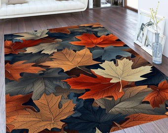 May include: A colorful area rug with a pattern of overlapping autumn leaves in shades of orange, red, brown, and gray.