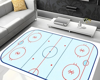 May include: A rectangular rug with a light blue hockey rink design. It features red and blue lines, circles, and face-off dots, with a blue border. The rug is designed to resemble a hockey rink, suitable for a living room.