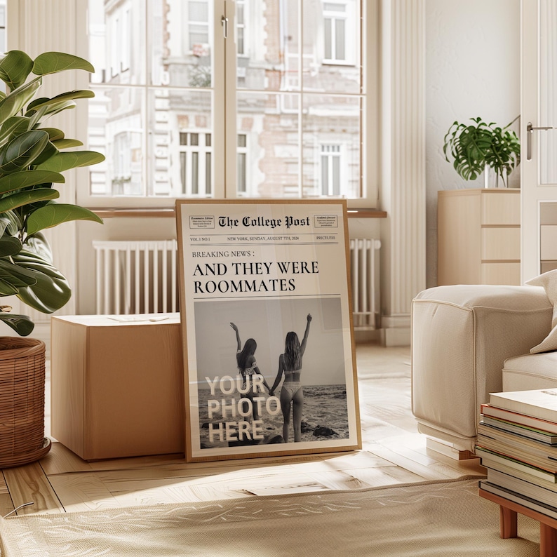 May include: A framed print of a newspaper article with the headline "Breaking News: And They Were Roommates". The article features a photo of two women on a beach. The text "Your Photo Here" is printed on the photo.