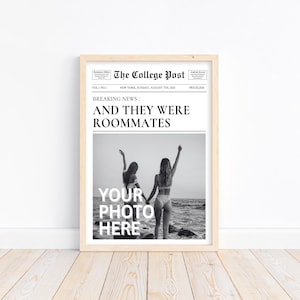 May include: A black and white photograph of two people standing on a beach with their arms raised in the air. The photo is framed in a light wood frame and has the text "The College Post" and "Breaking News: And they were roommates" printed above the photo. The text "Your photo here" is printed below the photo.