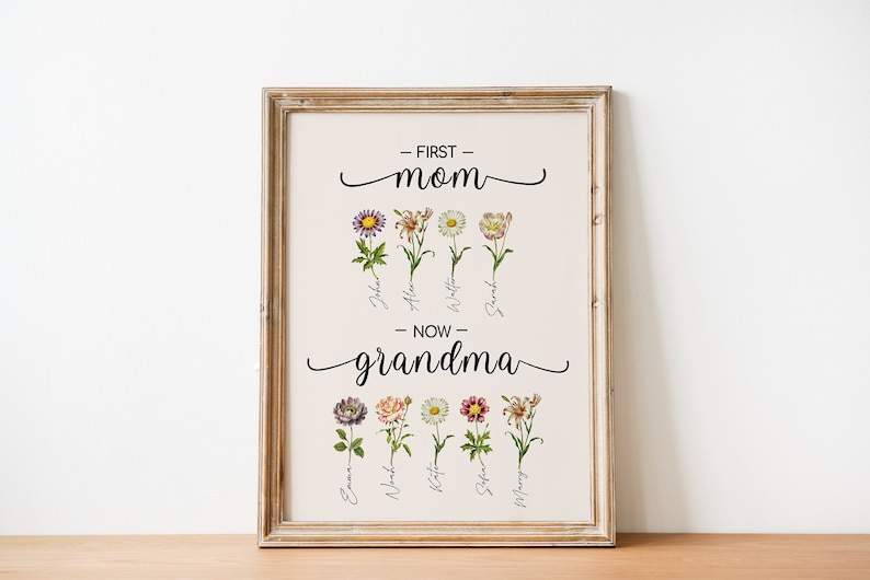 May include: A framed print with the text "First Mom" and "Now Grandma" with floral illustrations and names of children below each flower.