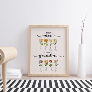 May include: A framed print with the text "First Mom - Now Grandma" and floral illustrations. The flowers are labeled with names like "Alexa", "Katie", "Sarah", and "Gregory".