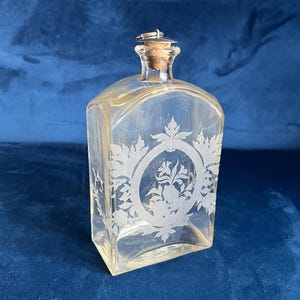Antique etched glass spirit decanter or apothecary bottle