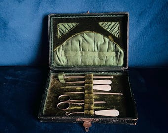 Antique cased manicure set with pearl handled tools