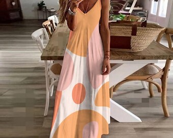 May include: A long, flowing dress with a V-neck and spaghetti straps. The dress features a colorful abstract pattern of orange, pink, and white shapes. The dress is made of a lightweight fabric, perfect for warm weather.