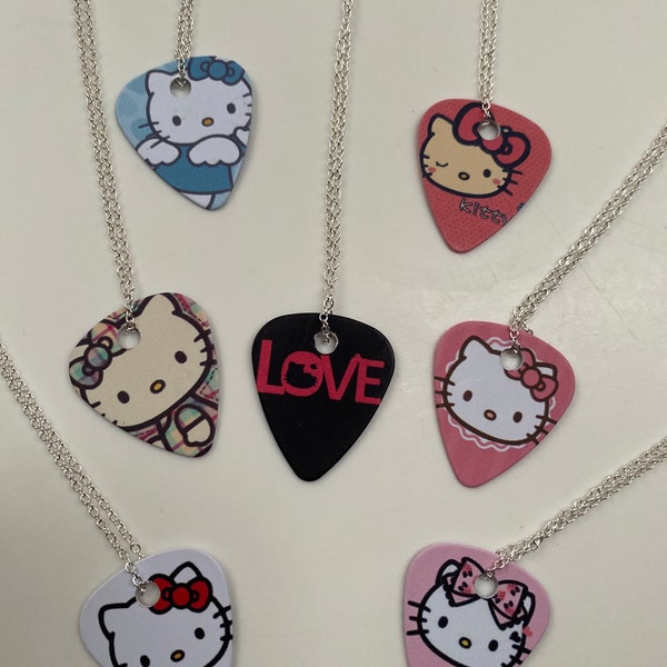 Hello Kitty Assorted silver plated guitar pick necklaces.