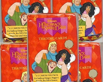 May include: Five packs of Disney's The Hunchback of Notre Dame trading cards. Each pack includes 11 cards, a finger puppet, a puzzle, a build-a-tower, a pop-out and more.