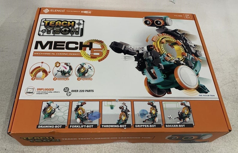 Puede incluir: Una caja para un kit de robot de codificaci&oacute;n mec&aacute;nica Teach Tech Mech 5. La caja muestra un robot verde, negro y naranja con m&aacute;s de 220 piezas. La caja tambi&eacute;n muestra cinco configuraciones de robots diferentes: robot de dibujo, robot de carretilla elevadora, robot de lanzamiento, robot de agarre y robot de f&uacute;tbol.