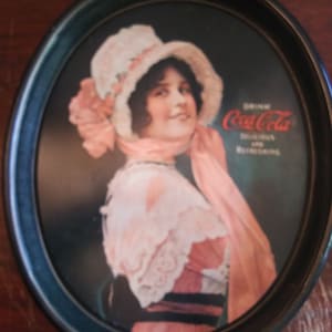 A "Drink Coca-Cola Delicious & Refreshing" Oval Advertising Serving Metal Tray